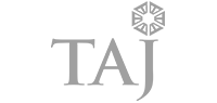 Greyscale Taj Hotels logo.